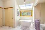 Soaking Tub and Walk-in Shower with heated floors in master bath.